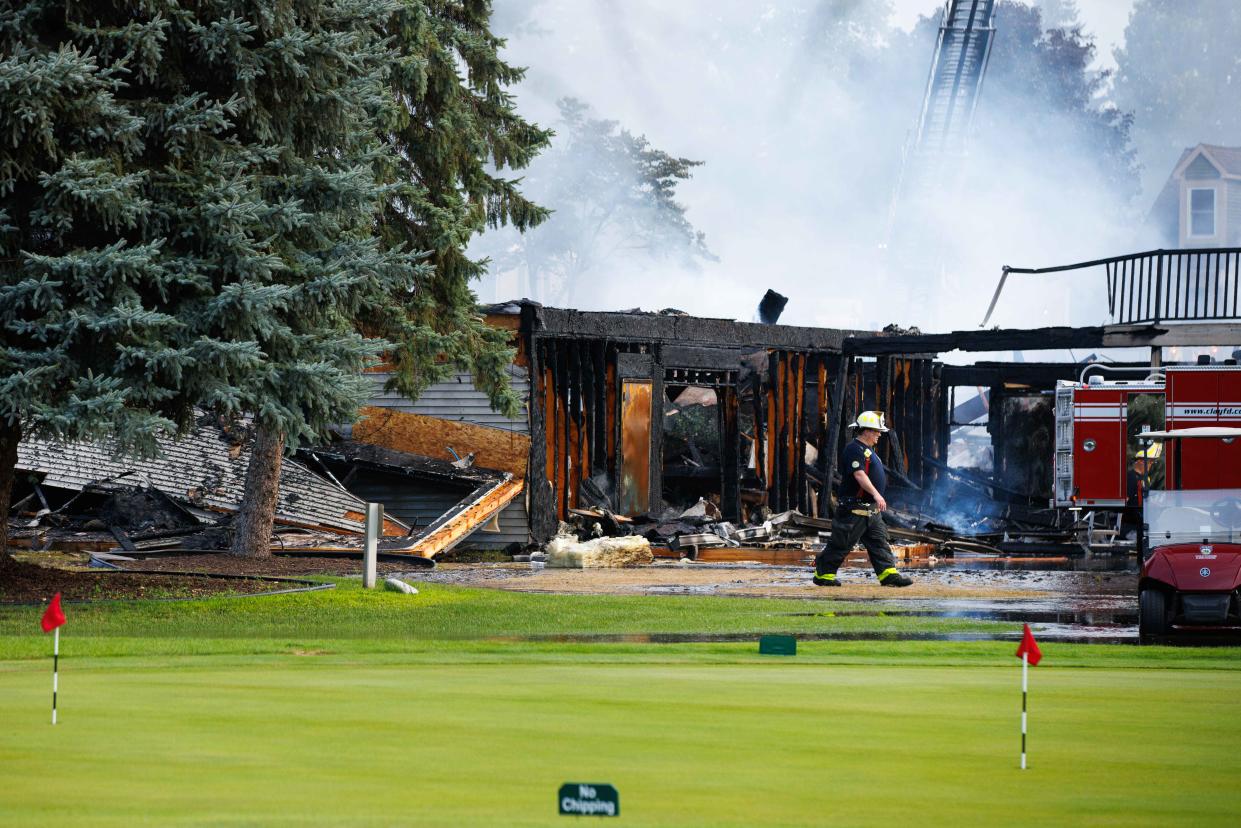 Firefighters work to put out a fire at the Juday Creek Golf Course clubhouse on Monday, Aug. 26, 2024, in Granger.