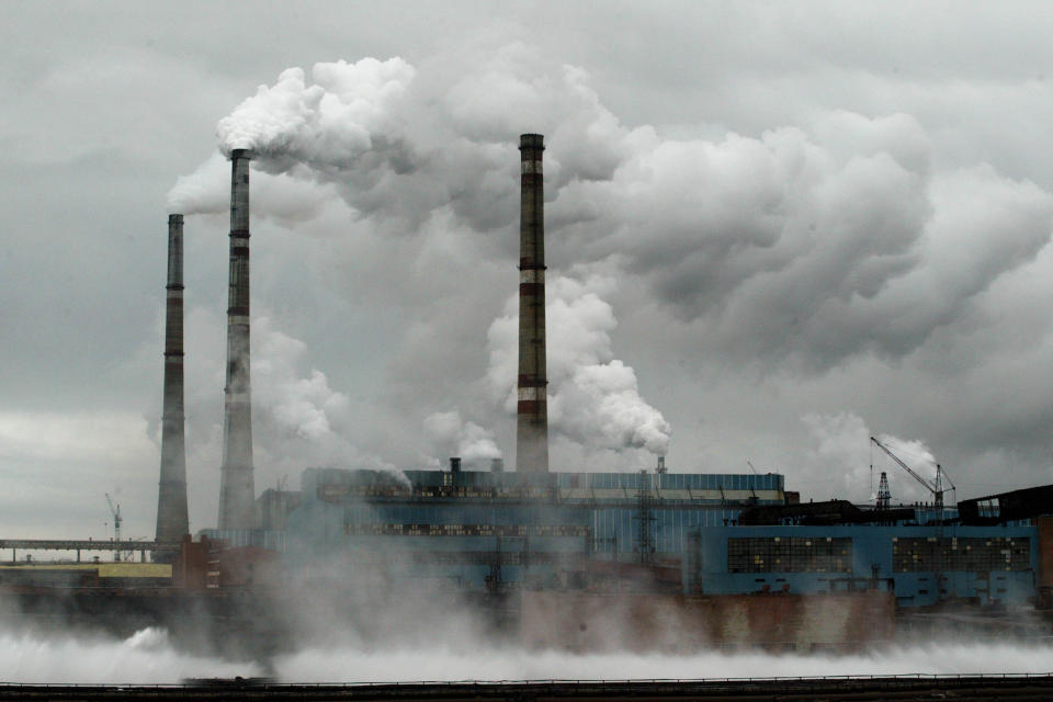 Image: Smoke stacks for a nickel-refinery spew sulfur dioxide into the environment July 21, 2002 in Norilsk, Russia. (Oleg Nikishin / Getty Images file)