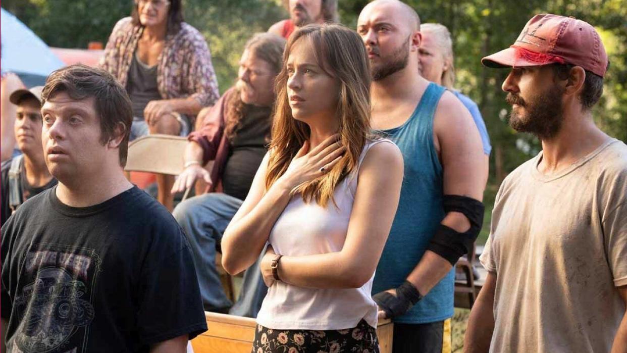  (L-R) Zack Gottsagen as Zak, Dakota Johnson as Eleanor and Shia LaBeouf as Tyler in "The Peanut Butter Falcon" now streaming on Netflix. 