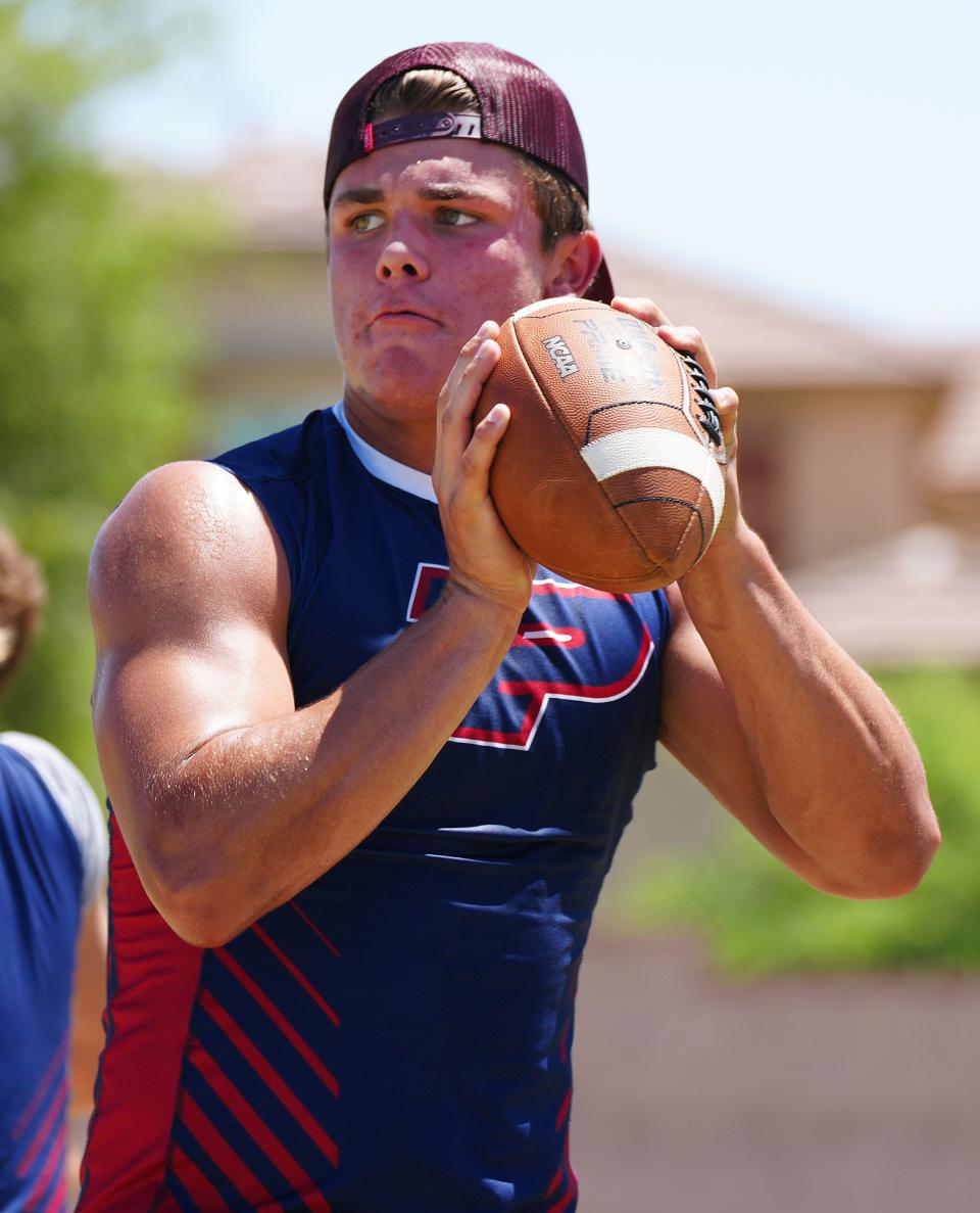 May 18, 2022; Gilbert, Arizona; USA; Perry's QB Jack Amer throws passes during Chandler district Jamboree at Perry High School.