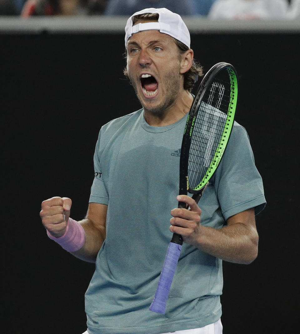 France's Lucas Pouille celebrates after defeating Australia's Alexei Popyrin in their third round match at the Australian Open tennis championships in Melbourne, Australia, Sunday, Jan. 20, 2019. (AP Photo/Kin Cheung)