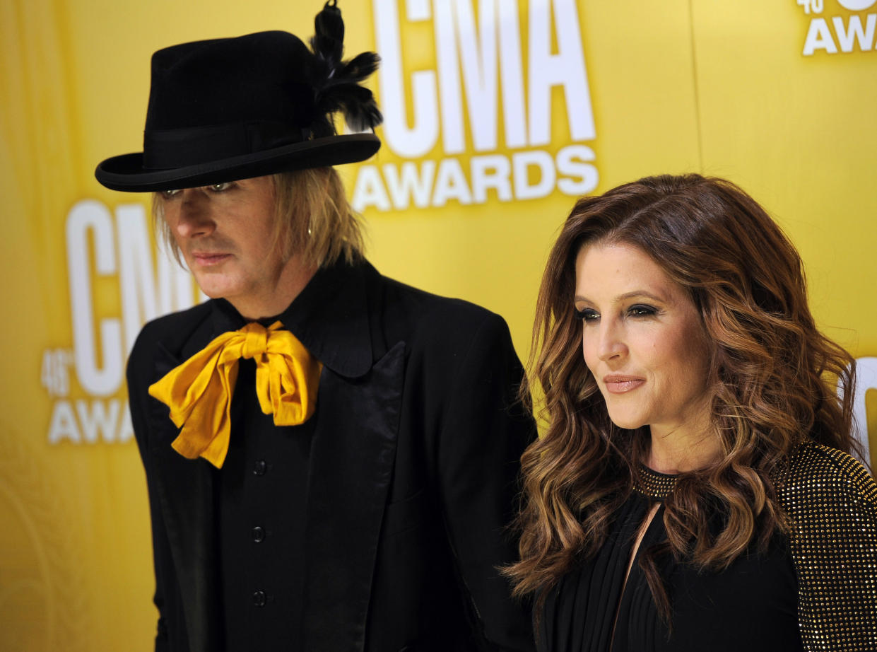 Michael Lockwood, left, and Lisa Marie Presley arrive at the 46th Annual Country Music Awards at the Bridgestone Arena on Thursday, Nov. 1, 2012, in Nashville, Tenn. (Photo by Chris Pizzello/Invision/AP)