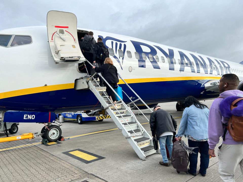 Passengers boarding a Ryanair Boeing 737-800 at Stansted Airport