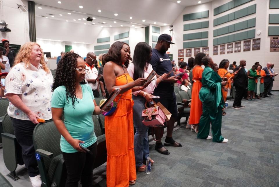 About 100 people attended a street-naming ceremony on Saturday at Eastside High School in honor of Mae Islar, the first woman principal of the school (1977-83).