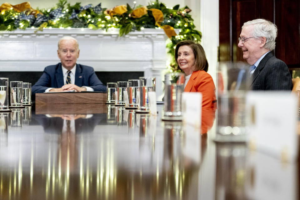 FILE - President Joe Biden, left, accompanied by House Speaker Nancy Pelosi of Calif., second from right, and Senate Minority Leader Mitch McConnell of Ky., right, speaks at the top of a meeting with congressional leaders to discuss legislative priorities for the rest of the year, Nov. 29, 2022, in the Roosevelt Room of the White House in Washington. By temperament and manner, Joe Biden and Mitch McConnell are decidedly mismatched. But as the days of divided government under Biden begin, their long relationship will become even more vital. (AP Photo/Andrew Harnik, File)