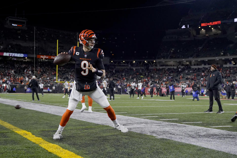 Cincinnati Bengals quarterback Joe Burrow (9) warms up before an NFL wild-card playoff football game against the Baltimore Ravens in Cincinnati, Sunday, Jan. 15, 2023. (AP Photo/Jeff Dean)