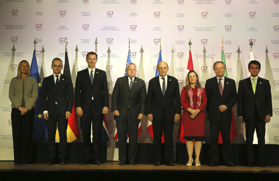 From left to right, European Union High Representative for Foreign Affairs and Security Policy Federica Mogherini, Germany's Foreign Minister Heiko Maas, Britain's Foreign Secretary Jeremy Hunt, US Deputy Secretary of State John J. Sullivan, French Foreign Minister Jean-Yves Le Drian, Canada's Foreign Minister Chrystia Freeland, Italy's Foreign Minister Enzo Moavero Milanesi and Japanese Foreign Minister Taro Kono pose for a group photo during a G7 meeting at ministerial level in Dinard, Brittany, Friday, April 5, 2019. The G7 meeting is focus on cybersecurity, the trafficking of drugs, arms and migrants in Africa's troubled Sahel region, and fighting gender inequality. (AP Photo/David Vincent)