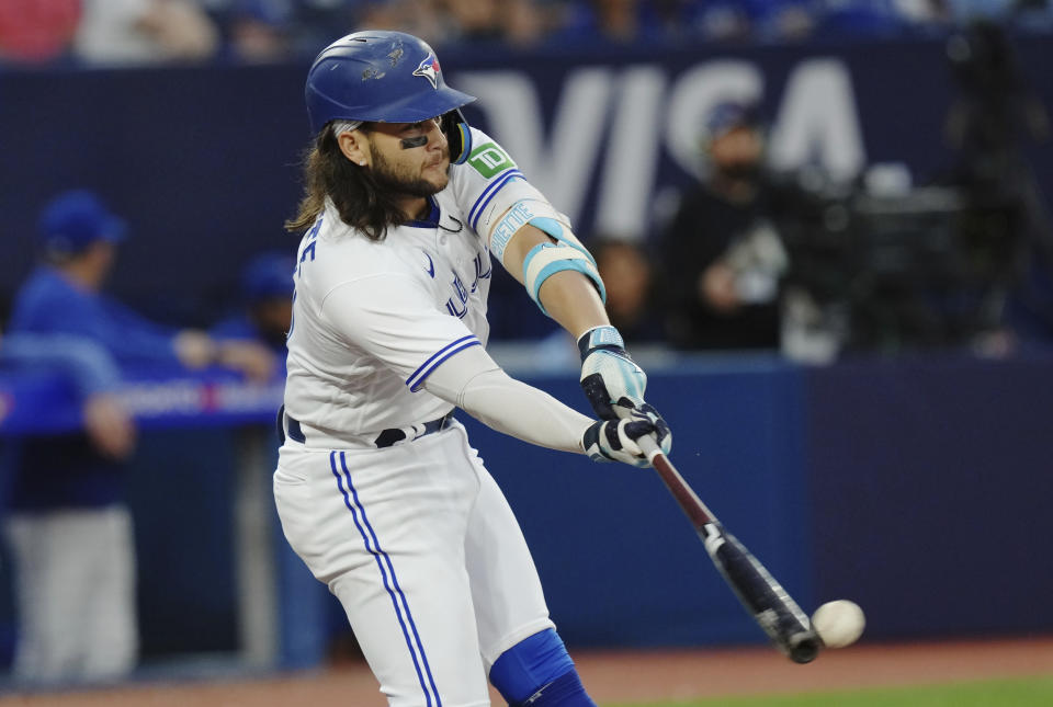 Toronto Blue Jays' Bo Bichette hits a single against the San Diego Padres during the fifth inning of a baseball game Wednesday, July 19, 2023, in Toronto. (Chris Young/The Canadian Press via AP)