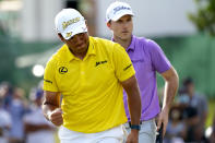 Hideki Matsuyama, of Japan, pumps his fist after making birdie on the 15th green as Russell Henley looks on during the final round of the Sony Open golf tournament, Sunday, Jan. 16, 2022, at Waialae Country Club in Honolulu. (AP Photo/Matt York)