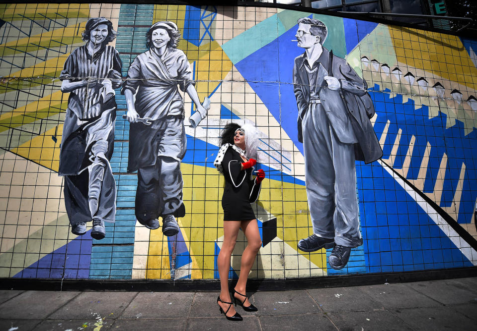 <p>A drag queen stands against a mural as she waits for the start of the Belfast Gay Pride march on August 5, 2017 in Belfast, Northern Ireland. (Photo: Charles McQuillan/Getty Images) </p>