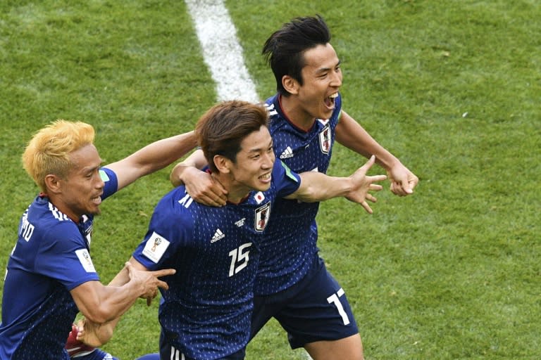Japan forward Yuya Osako (centre) celebrates after scoring the winning goal against Colombia