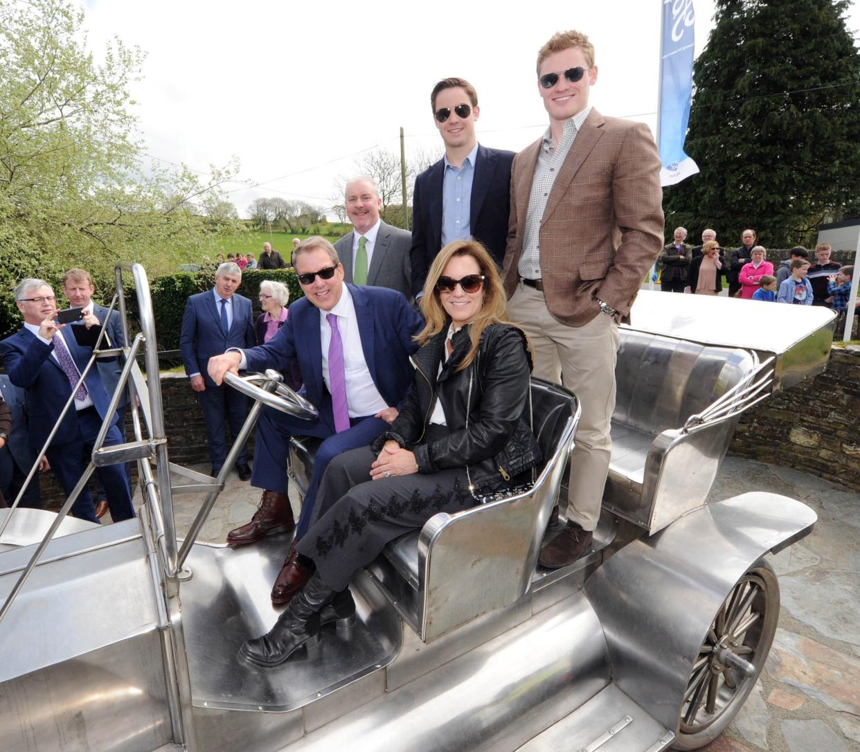 Bill Ford, executive chairman, Ford Motor Co., with his wife Lisa and their sons Will and Nick and Ciarán McMahon, chairman and managing director, Henry Ford & Son Ltd., on the replica of the Ford Model T in 2017 at Ballinascarthy, County Cork, Ireland.