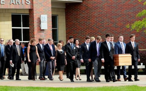 Warmbier's coffin is carried to the hearse after a funeral service in June - Credit: Reuters