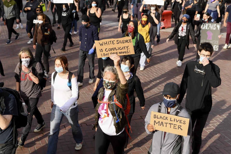 Demonstrators march in San Francisco on Sunday, May 31, 2020, protesting the death of George Floyd, who died after being restrained by Minneapolis police officers on May 25. (AP Photo/Noah Berger)