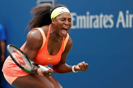 Serena Williams of the United States reacts after winning the first set against Kiki Bertens of the Netherlands (not pictured) on day three of the 2015 U.S. Open tennis tournament at USTA Billie Jean King National Tennis Center. Geoff Burke-USA TODAY Sports