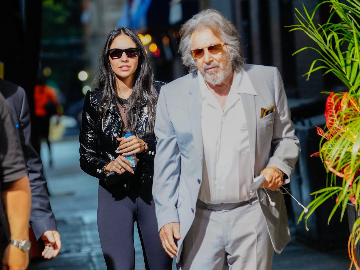 Noor Alfallah and Al Pacino arrive for a music video shoot with Bad Bunny on August 24, 2023 in New York City.