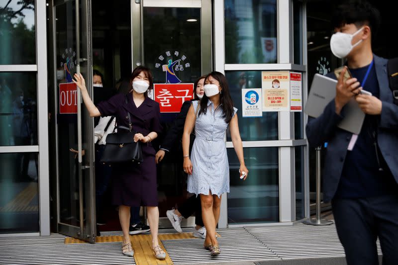 Kara Bos, whose Korean name is Kang Mee-sook when she was adopted in 1984 and is now seeking her biological parents, walks out after attending her trial at a court in Seoul