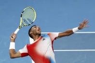 Felix Auger-Aliassime of Canada serves to Daniil Medvedev of Russia during their quarterfinal match at the Australian Open tennis championships in Melbourne, Australia, Wednesday, Jan. 26, 2022. (AP Photo/Hamish Blair)