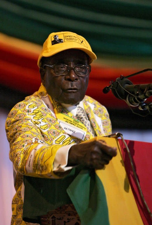 Zimbabwe president Robert Mugabe delivers a speech at his ZANU-PF party's annual national conference in Gweru. He demanded Zimbabwean firms be 100 percent black owned, in a pre-election gambit that looks sure to spook foreign investors