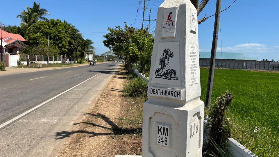 White markers along a highway on the Bataan Peninsula show the route from the 1942 Bataan Death March. - Brad Lendon/CNN