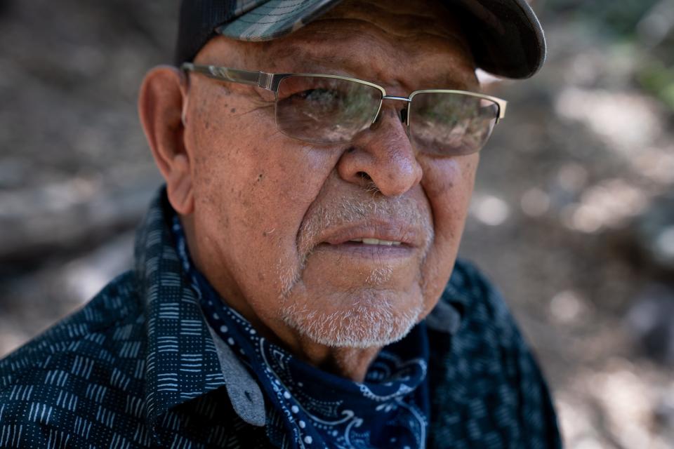 A portrait of Ramon Riley, cultural resource director for the White Mountain Apache Tribe, at the East Fork White River on June 19, 2023, in Fort Apache, Ariz.