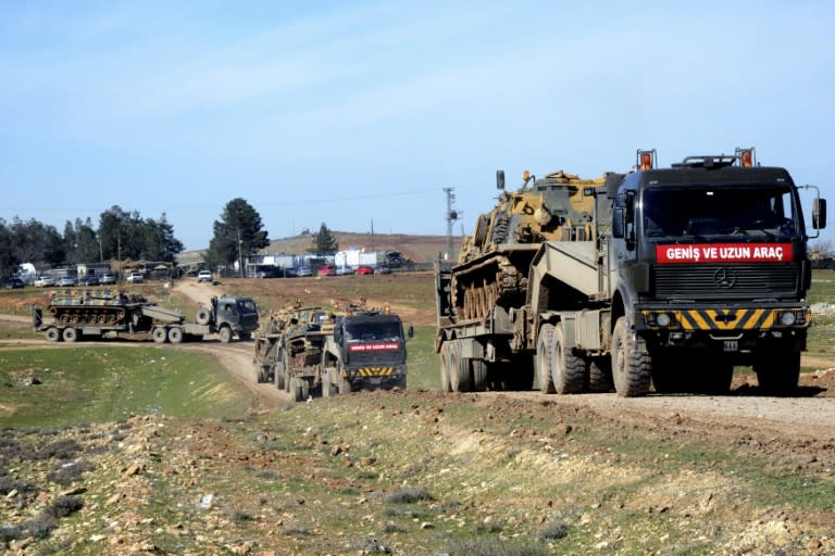 Turkish military vehicles and tanks are deployed in Surac, near the border with Syria