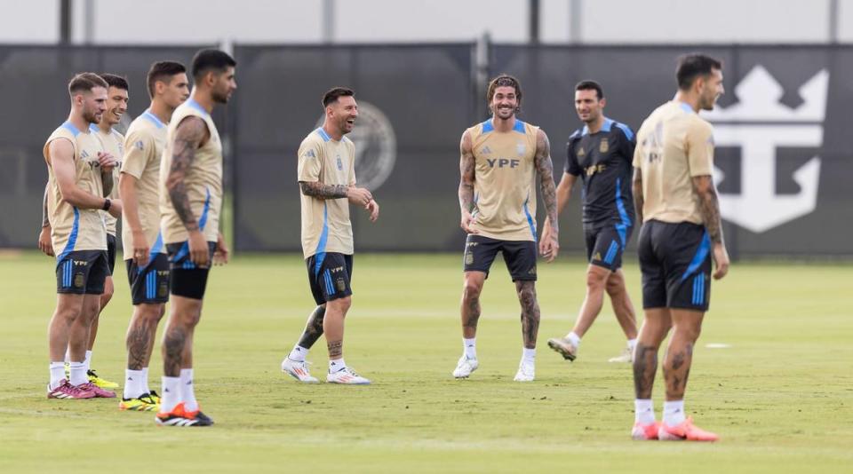 Argentina’s forward Lionel Messi, center, laughs with his teammates at the Florida Blue Training Center.