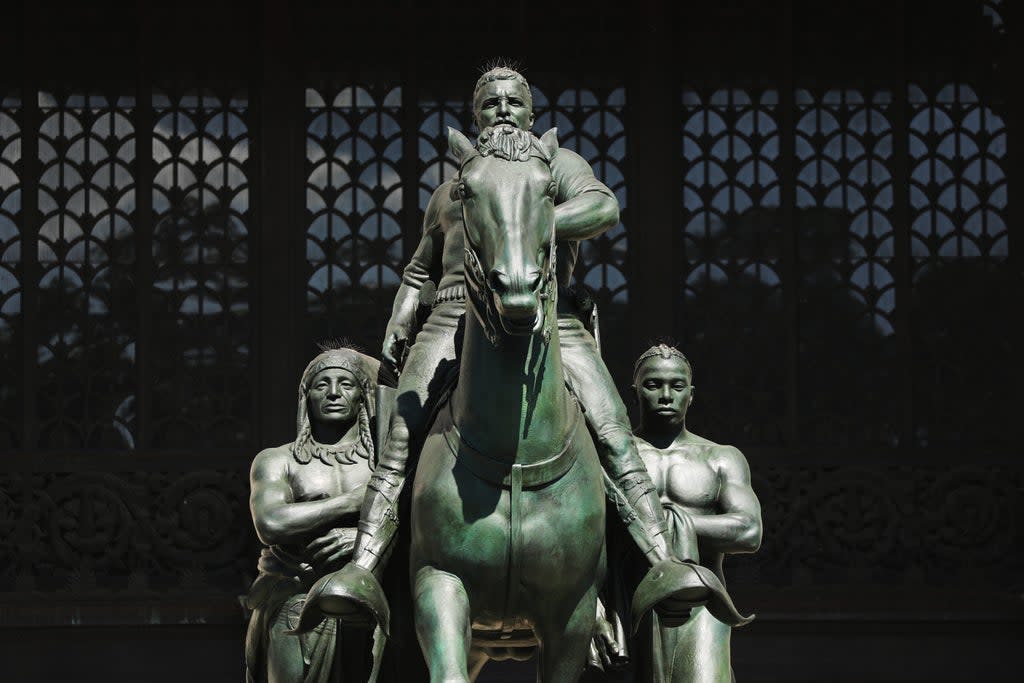 The controversial statue of former president Theodore Roosevelt, which has now been removed, stood outside the Museum of Natural History for over 80 years  (Getty Images)