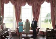 Britain's Camilla, Duchess of Cornwall, with owners Constance Cassidy and Eddie Walsh during a visit with Prince Charles, Prince of Wales, to Lissadell House May 20, 2015. REUTERS/Eddie Mulholland/Pool