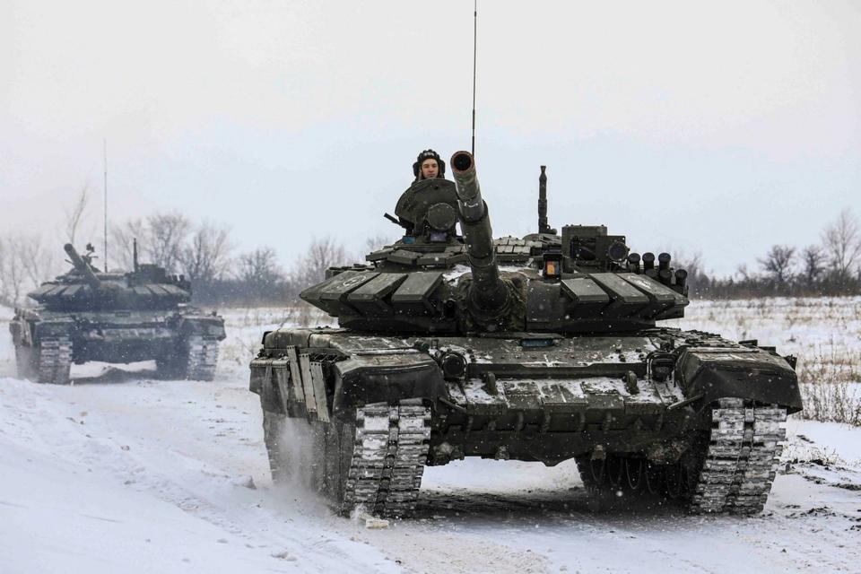 Russian tanks roll on the field in Leningrad, Russia.