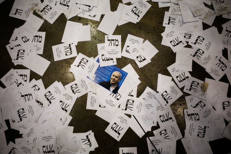 Israeli Prime Minister Benjamin Netanyahu's Likud party election ballots are seen on the floor following Netanyahu's address to supporters at the party headquarters in Tel Aviv