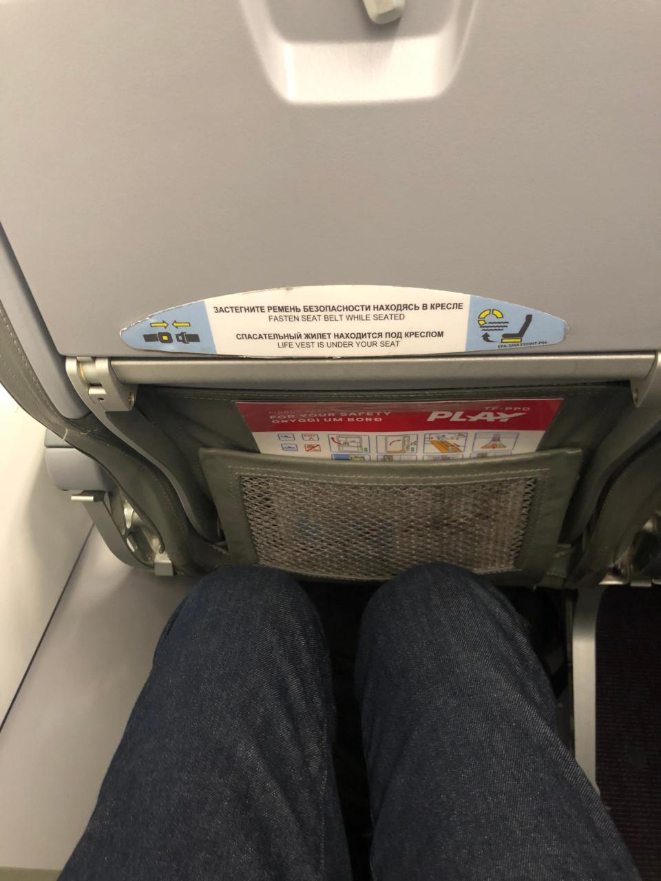 Stickers in Russian on my second Play flight. To give you a sense of how close together the seats were: I'm 5'7".