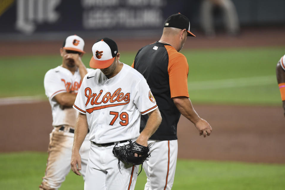 Baltimore Orioles relief pitcher Konner Wade (79) is removed from the game by Baltimore Orioles manager Brandon Hyde during the fourth inning of a baseball game against the Los Angeles Angels, Tuesday, Aug. 24, 2021, in Baltimore. (AP Photo/Terrance Williams)