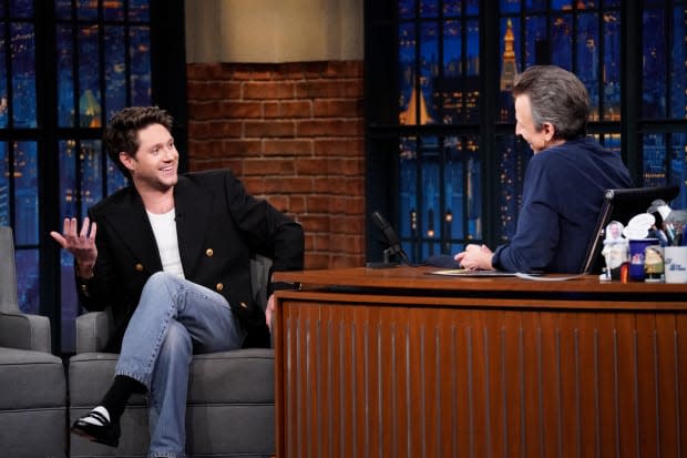 Niall Horan in a Gucci blazer and Levi's jeans on "<em>Late Night</em> With <em>Seth Meyers."</em><p>Photo: Lloyd Bishop/NBC via Getty Images</p>