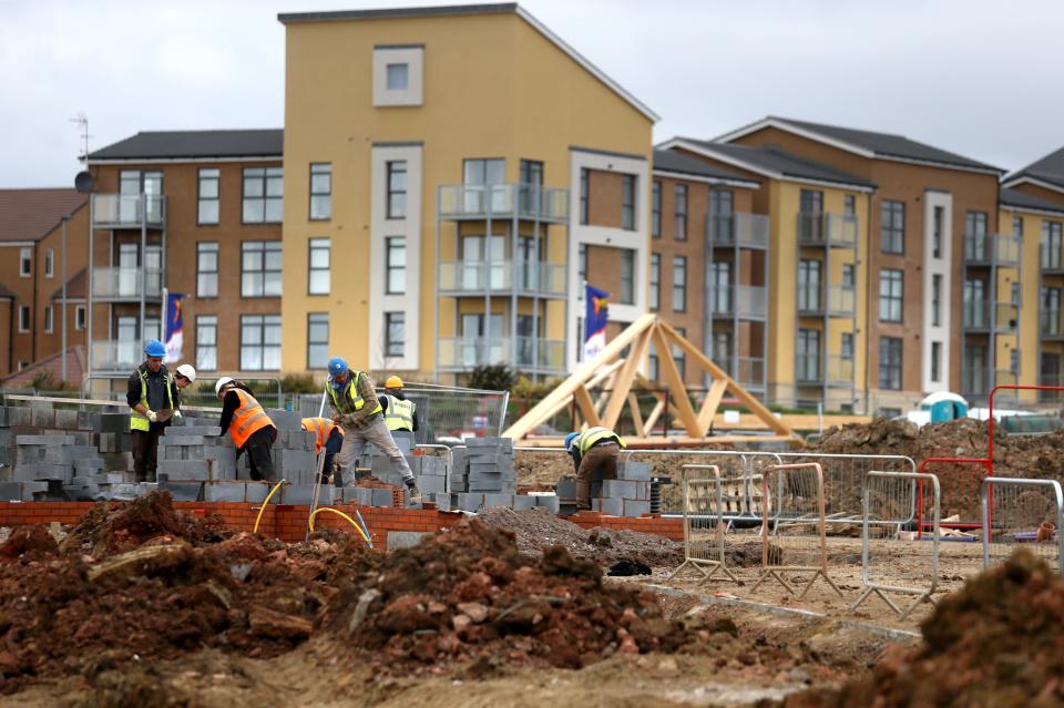 BRISTOL, UNITED KINGDOM - MARCH 18:  Construction workers continue to build new houses on a housing development on March 18, 2014 in Bristol, England.  A number of housebuilders are now constructing more homes this year than they did during the 2007 market peak, thanks to overseas investment and the government's Help to Buy scheme, which has been extended until 2020, boosting the property market and speeding up the number of new homes being built.  (Photo by Matt Cardy/Getty Images)