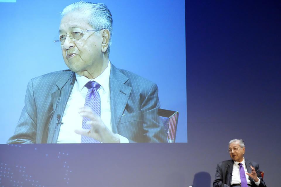 Malaysia's former Prime Minister Mahathir Mohamad answers a question at a session of the International Conference on "The Future of Asia" Friday, May 27, 2022 in Tokyo. (AP Photo/Eugene Hoshiko)