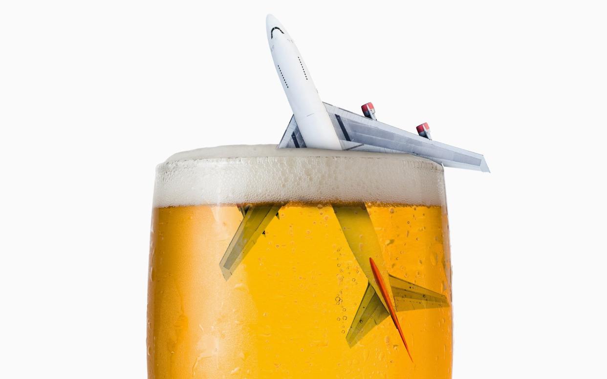 Airplane flying out of a pint of beer