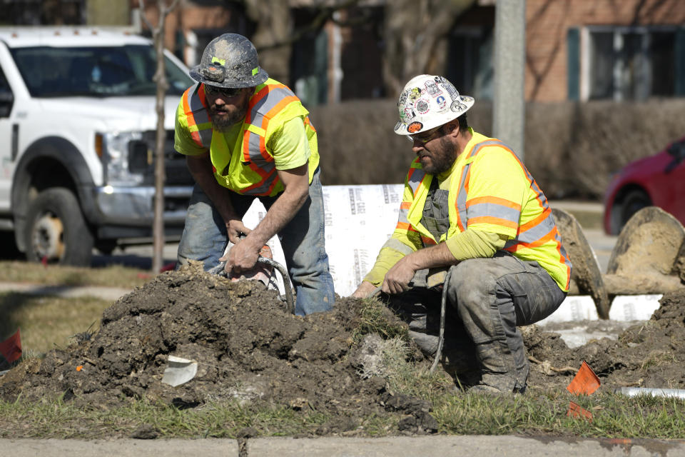 FILE - Construction workers work in Mount Prospect, Ill., Monday, Feb. 26, 2024. On Friday, April 5, 2024, the U.S. government issues its March jobs report. (AP Photo/Nam Y. Huh, File)