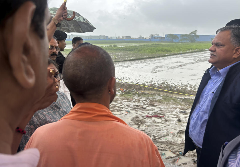 Uttar Pradesh State Chief Minister Yogi Adityanath visit the place where a fatal stampede took place in Fulrai village of Hathras district, Uttar Pradesh, India, Wednesday, July 3, 2024. Thousands of people at a religious gathering rushed to leave a makeshift tent, setting off a stampede Tuesday that killed more than hundred people and injured scores. (AP Photo/Rajesh Kumar Singh)