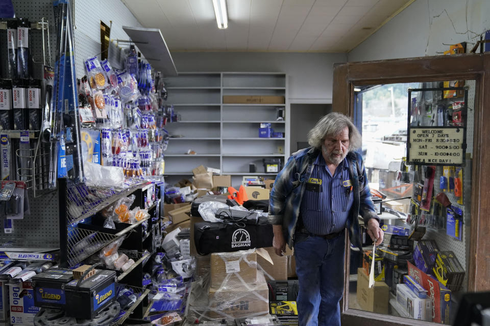 Kenny Ransbottom walks through debris inside his auto parts store after an earthquake in Rio Dell, Calif., Tuesday, Dec. 20, 2022. A strong earthquake shook a rural stretch of Northern California early Tuesday, jolting residents awake, cutting off power to 70,000 people, and damaging some buildings and a roadway, officials said. (AP Photo/Godofredo A. Vásquez)