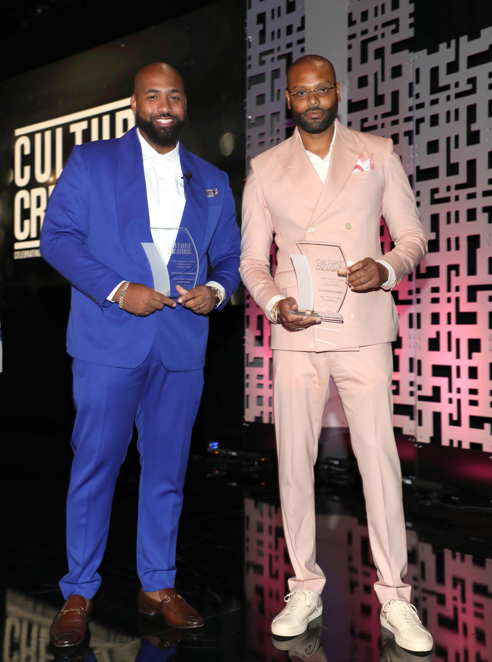 BEVERLY HILLS, CALIFORNIA – JUNE 23: Honorees Troy Millings and Rashad Bilal of Earn Your Leisure pose onstage after receiving the Business/ Tech award during the the Culture Creators Awards Brunch at The Beverly Hilton on June 23, 2022 in Beverly Hills, California. (Photo by Jerritt Clark/Getty Images for Culture Creators)