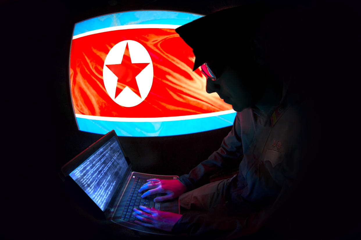 N. Korean hacker silhouette with North Korean Flag