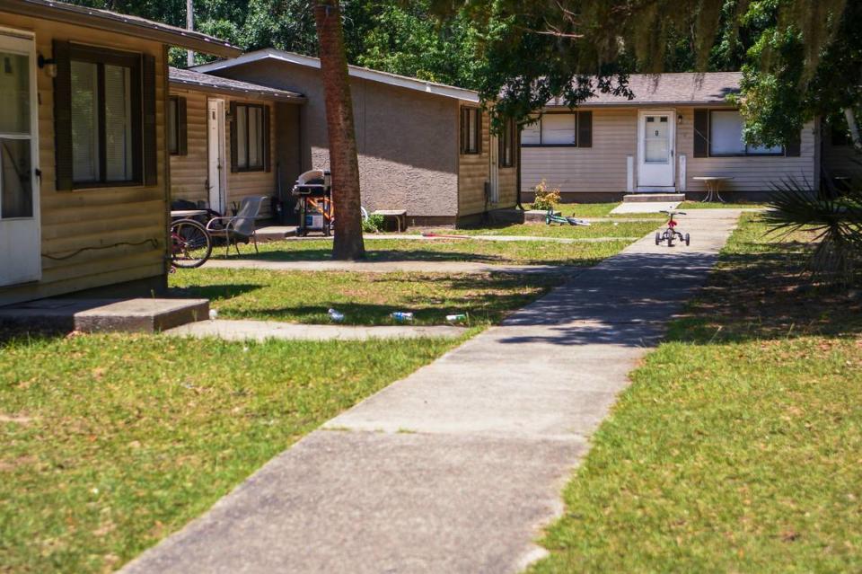 A lone tricycle sits riderless on the sidewalk on May 25, 2023 at Chimney Cove Apartments on Hilton Head Island. The existing owner has submitted plans to redevelop the land into luxury apartments.