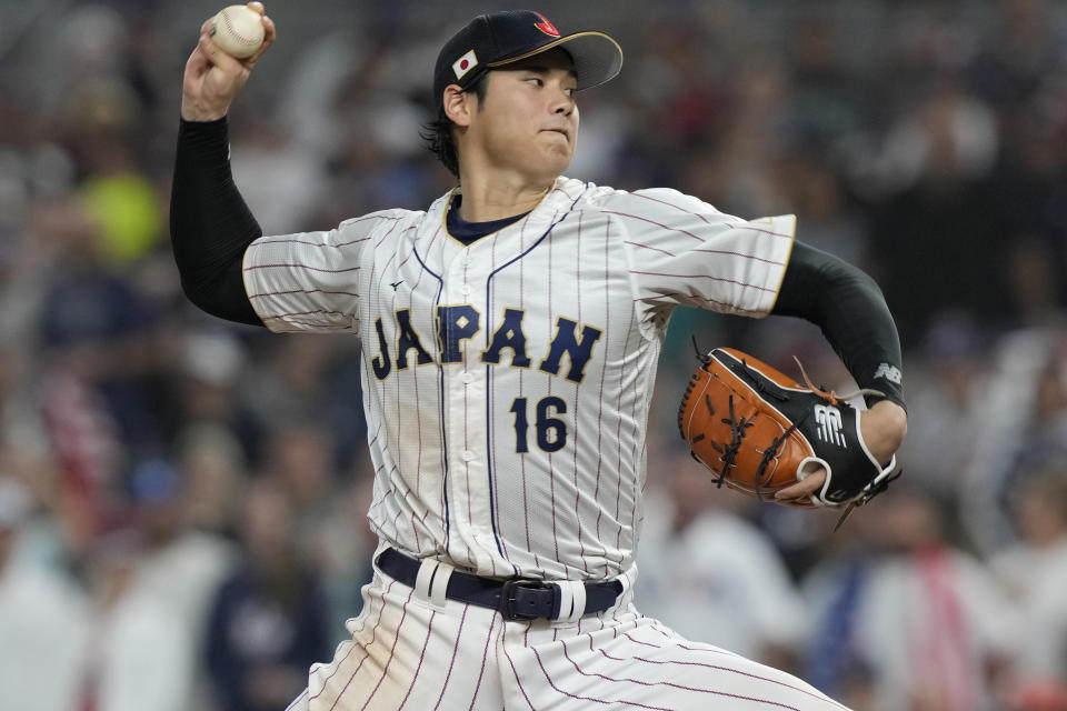 Japan pitcher Shohei Ohtani (16) aims a pitch during the ninth inning of a World Baseball Classic final game against the U.S., Tuesday, March 21, 2023, in Miami. Japan defeated the U.S. 3-2. (AP Photo/Marta Lavandier)