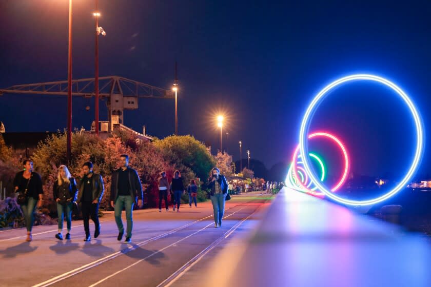 Youths walk on quay Des Anneaux near the Warehouse nightclub, Wednesday, May 18, 2022 in Nantes, western France.