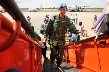 A Japanese soldier part of the last group of Japanese soldiers from the United Nations Mission in South Sudan (UNMISS) boards a plane at the Juba International Airport, as Japan withdraws from a mission in South Sudan, in Juba, South Sudan May 25, 2017. REUTERS/Jok Solomun