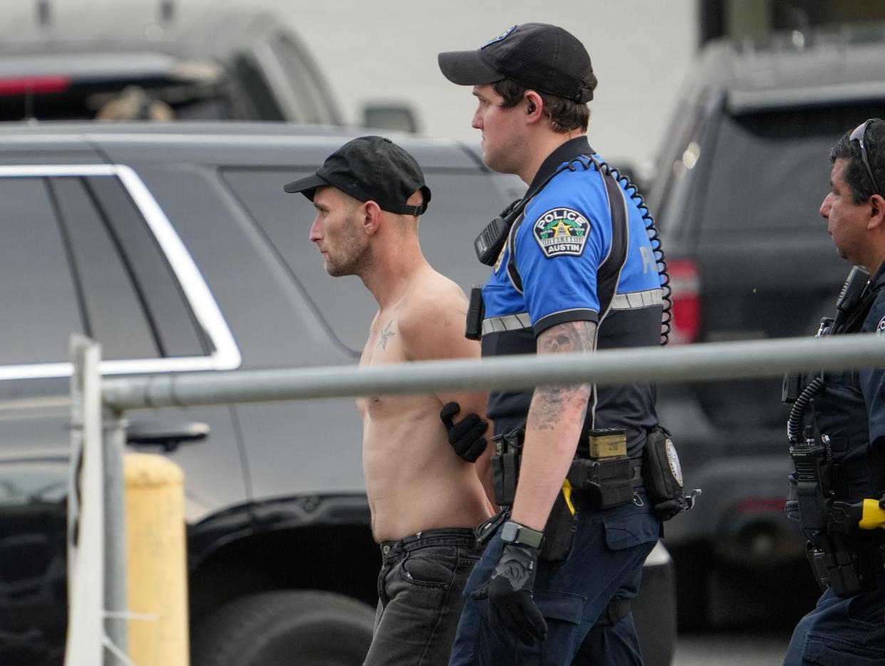 A man is arrested on Frday on S. Lamar Boulevard near Barton Springs Road after a large police presence, including SWAT officers, responded to the event.