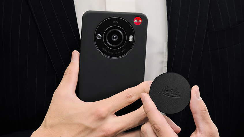  Two hands holding the Leica Leitz Phone 3. 