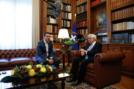 Greek Prime Minister Alexis Tsipras briefs Greek President Prokopis Pavlopoulos on developments on the name dispute with Macedonia, in Athens, Greece May 19, 2018. REUTERS/Costas Baltas