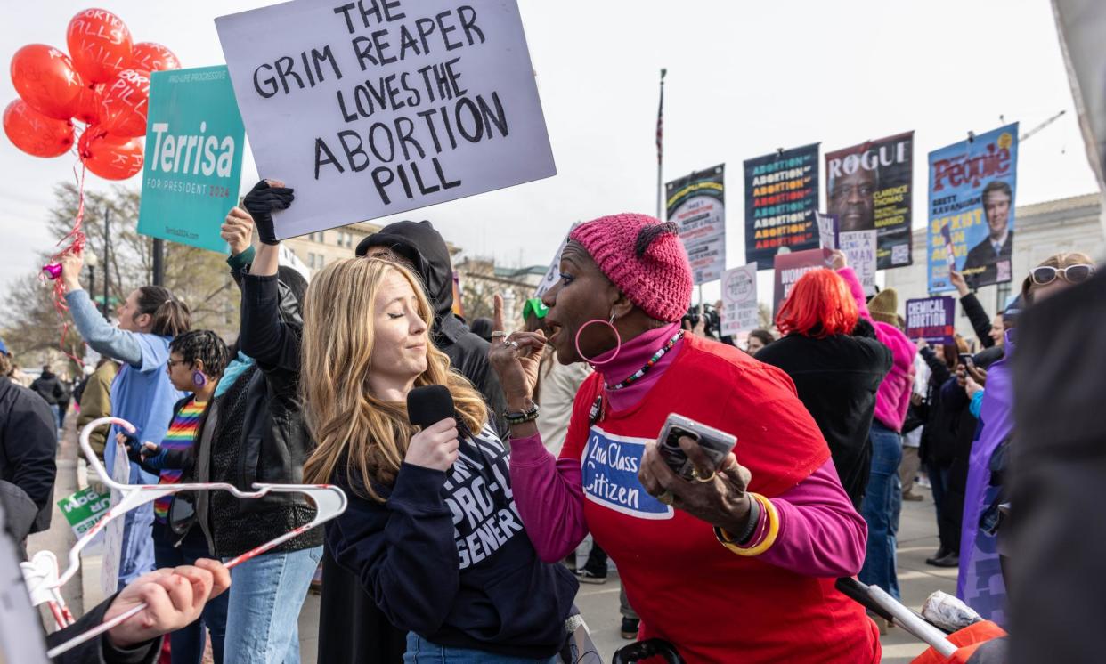 <span>Demonstrators gather in front of the US supreme court in Washington DC on Tuesday.</span><span>Photograph: Anna Rose Layden/Getty Images</span>